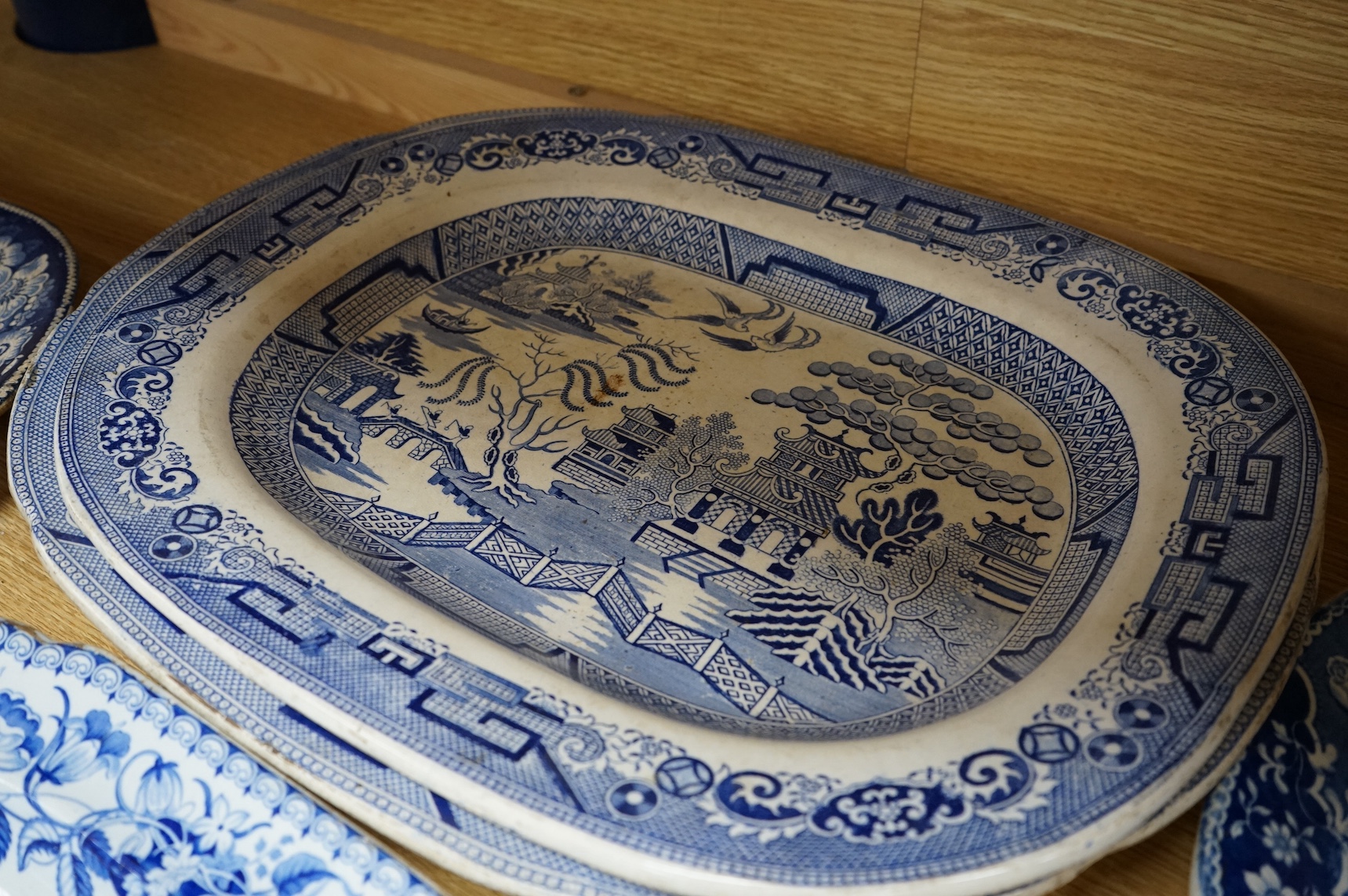 Six 19th century blue and white stoneware meat dishes to include Roger’s Staffordshire zebra pattern, largest 50cm wide. Condition - varies